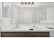 Bathroom featuring double sinks with white countertops, vanity and large decorative mirror over the sinks at 10462 Lucaya Dr, Tampa, FL 33647