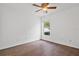 Bedroom with a window and a ceiling fan at 10462 Lucaya Dr, Tampa, FL 33647