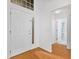 Bright foyer with decorative glass front door and access to hall and bathroom at 10462 Lucaya Dr, Tampa, FL 33647