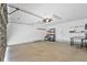 The spacious garage has high ceilings with storage racks and an automatic garage door at 10462 Lucaya Dr, Tampa, FL 33647