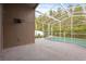 Covered lanai with pool views offers perfect space for relaxation or outdoor entertaining at 10462 Lucaya Dr, Tampa, FL 33647