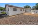 Spacious backyard with a bark mulch area offering a private outdoor space and home exterior at 105 Melrose Dr, Safety Harbor, FL 34695