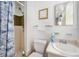 Compact bathroom with tiled shower, white fixtures, and ample lighting for a clean and functional space at 105 Melrose Dr, Safety Harbor, FL 34695