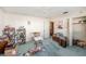 Bedroom with carpet flooring, a ceiling fan, closet, and natural light, creating a comfortable retreat at 105 Melrose Dr, Safety Harbor, FL 34695