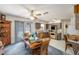 Open-concept kitchen and dining area with wood cabinets, an eat-in table, and a ceiling fan at 105 Melrose Dr, Safety Harbor, FL 34695