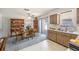 Bright kitchen and dining area featuring a ceiling fan, wood cabinets, and a breakfast nook at 105 Melrose Dr, Safety Harbor, FL 34695