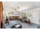 Comfortable living room with a ceiling fan, and a view of the front yard, perfect for relaxation and entertainment at 105 Melrose Dr, Safety Harbor, FL 34695