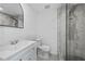 Bathroom featuring a glass shower with stylish marble tiling and a modern vanity at 10730 Premier Ave, Port Richey, FL 34668