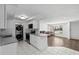 Modern kitchen with white cabinets, stainless steel appliances, and lots of counter space at 10730 Premier Ave, Port Richey, FL 34668