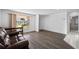 Inviting living room with hardwood floors and a view of the outside at 10730 Premier Ave, Port Richey, FL 34668