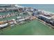 Picturesque aerial view of waterfront condos, docks, boats, and cityscape at 120 Brightwater Dr, Clearwater Beach, FL 33767