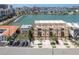 Aerial view of luxury townhomes featuring private garages and manicured landscaping at 120 Brightwater Dr, Clearwater Beach, FL 33767