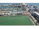 Panoramic aerial view showcases waterfront condos, docks, boats, and cityscape at 120 Brightwater Dr, Clearwater Beach, FL 33767