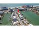 Aerial view of a waterfront community with docks, boats, and ocean access at 120 Brightwater Dr, Clearwater Beach, FL 33767