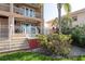Beautiful landscaped yard leading to outdoor living spaces at 120 Brightwater Dr, Clearwater Beach, FL 33767