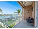 Relax on this private balcony with views of the waterfront and boat docks at 120 Brightwater Dr, Clearwater Beach, FL 33767