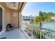 Balcony view showcasing a waterfront harbor and nearby condominium buildings at 120 Brightwater Dr, Clearwater Beach, FL 33767