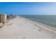 Sweeping beach view with ocean and pier, showcasing a vibrant coastal scene perfect for relaxation and recreation at 120 Brightwater Dr, Clearwater Beach, FL 33767