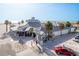 Aerial view of a beachfront restaurant with palm trees and outdoor seating, perfect for enjoying meals by the ocean at 120 Brightwater Dr, Clearwater Beach, FL 33767