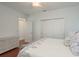 Bright bedroom featuring hardwood floors, ample closet space, and a tranquil atmosphere for relaxation at 120 Brightwater Dr, Clearwater Beach, FL 33767