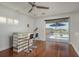 Bright entertainment room with a sleek bar area and sliding glass doors leading to a scenic balcony overlooking the water at 120 Brightwater Dr, Clearwater Beach, FL 33767