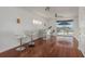 Entertainment room with bar, seating, and sliding doors to a balcony with waterfront views, perfect for relaxation at 120 Brightwater Dr, Clearwater Beach, FL 33767