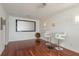 Spacious entertainment room featuring a screen, bar seating, and modern lighting, ideal for hosting gatherings at 120 Brightwater Dr, Clearwater Beach, FL 33767