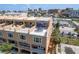 Desirable condo featuring private balconies and a rooftop terrace with seating and shade at 120 Brightwater Dr, Clearwater Beach, FL 33767