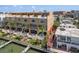 Waterfront condos featuring private balconies, pools, docks, and lush tropical landscaping at 120 Brightwater Dr, Clearwater Beach, FL 33767
