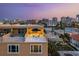 Gorgeous outdoor living space with rooftop terrace featuring beautiful city and water views at 120 Brightwater Dr, Clearwater Beach, FL 33767