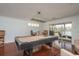 Spacious game room with a pool table and access to a waterfront balcony at 120 Brightwater Dr, Clearwater Beach, FL 33767