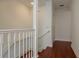 Hallway featuring a staircase leading upstairs and a door to a side room at 120 Brightwater Dr, Clearwater Beach, FL 33767