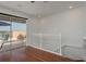Bright hallway leading to a balcony with waterfront views and dark hardwood flooring throughout at 120 Brightwater Dr, Clearwater Beach, FL 33767