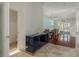Inviting hallway with a console table, leading to the dining area and a view of the waterfront at 120 Brightwater Dr, Clearwater Beach, FL 33767