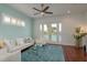 Bright living room with a water view and plantation shutters at 120 Brightwater Dr, Clearwater Beach, FL 33767