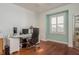 Well-lit office space featuring a sleek desk, comfortable chair, and bright window, ideal for productivity at 120 Brightwater Dr, Clearwater Beach, FL 33767