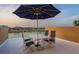 Enjoy outdoor dining on the patio with a view of the city skyline and waterfront at 120 Brightwater Dr, Clearwater Beach, FL 33767