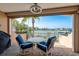 Cozy waterfront patio with comfortable seating and scenic water views at 120 Brightwater Dr, Clearwater Beach, FL 33767
