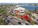 A vibrant outdoor location with marina views from a building with open air dining and outdoor umbrellas and water views at 120 Brightwater Dr, Clearwater Beach, FL 33767
