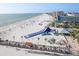 A bustling beach view including umbrellas, chairs, and a giant slide at 120 Brightwater Dr, Clearwater Beach, FL 33767