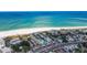Beautiful aerial view showcasing the beachside condo, sandy beach, and blue ocean at 12000 Gulf Blvd # 403-S, Treasure Island, FL 33706
