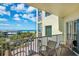 Relax on this spacious balcony with ocean views and comfortable seating area at 12000 Gulf Blvd # 403-S, Treasure Island, FL 33706