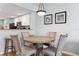 Cozy dining area with a round table and chairs, open to the kitchen at 12000 Gulf Blvd # 403-S, Treasure Island, FL 33706