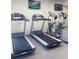 Modern exercise room with treadmills and elliptical machines for cardio workouts at 12000 Gulf Blvd # 403-S, Treasure Island, FL 33706