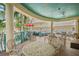 Outdoor dining area with seating and views of the landscaped grounds at 12000 Gulf Blvd # 403-S, Treasure Island, FL 33706
