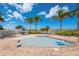 Relax by the beautiful pool with seating areas, palm trees and ocean views at 12000 Gulf Blvd # 403-S, Treasure Island, FL 33706