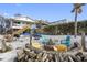 Inviting backyard with a firepit, picnic table, hammock, and beachside access, perfect for outdoor entertaining at 12458 1St W St, Treasure Island, FL 33706