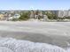 Gorgeous beachfront view of multiple houses along a pristine beach at 12458 1St W St, Treasure Island, FL 33706