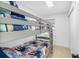 Charming bedroom with gray bunk beds, patriotic bedding, and a window letting in natural light at 12458 1St W St, Treasure Island, FL 33706