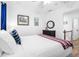 Bright bedroom featuring nautical decor and a view of the landing at 12458 1St W St, Treasure Island, FL 33706